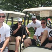 team pic by golf carts